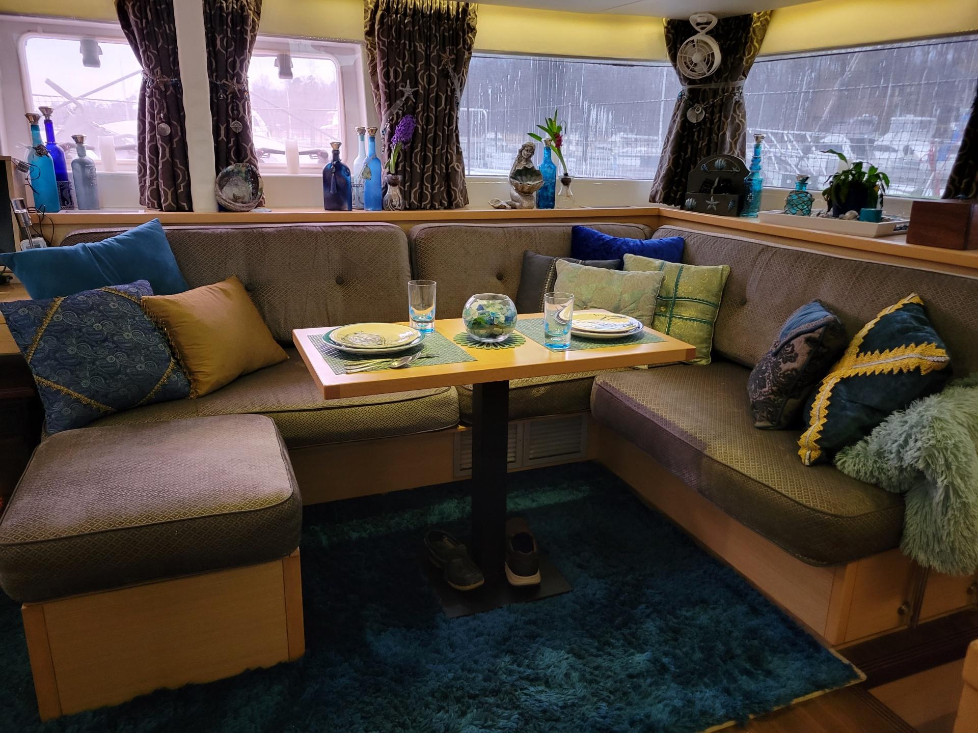 Luxurious interior of 2011 Lagoon 450 yacht with cozy seating and elegant decor.