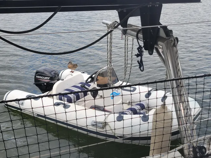 Bear, De Yacht Photos Pics Inflatable boat with Mercury engine on water, viewed from Lagoon 450 catamaran.