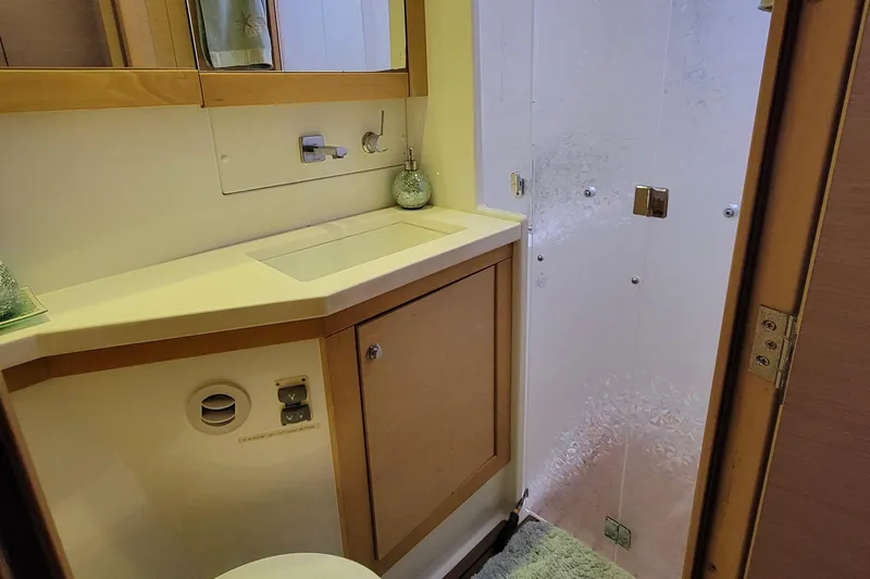 Bear, De Yacht Photos Pics Bathroom interior of 2011 Lagoon 450 yacht with modern fixtures and shower.
