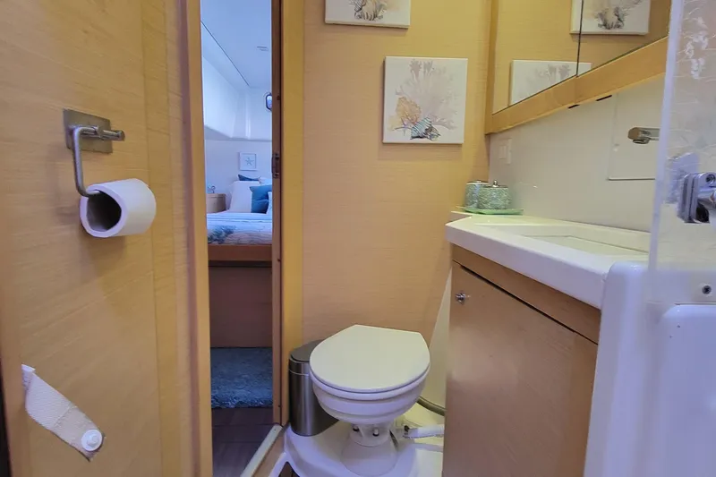 Bear, De Yacht Photos Pics Bathroom interior of 2011 Lagoon 450 yacht, featuring toilet and sink.