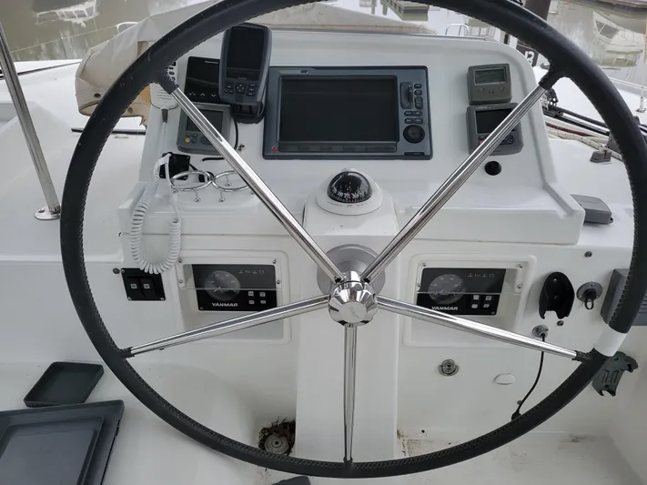 Bear, De Yacht Photos Pics Steering wheel and navigation controls of a 2011 Lagoon 450 catamaran.
