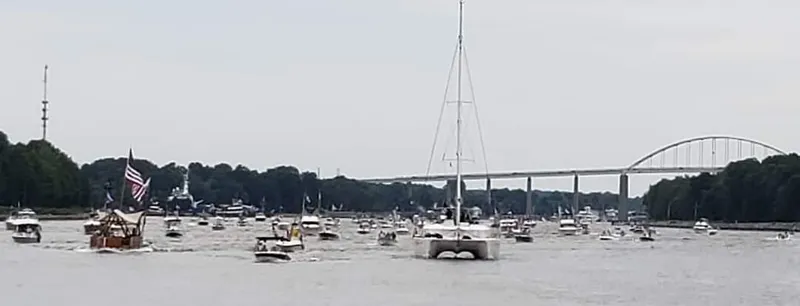 Bear, De Yacht Photos Pics Boats on a river with a bridge in the background, featuring a 2011 Lagoon 450.