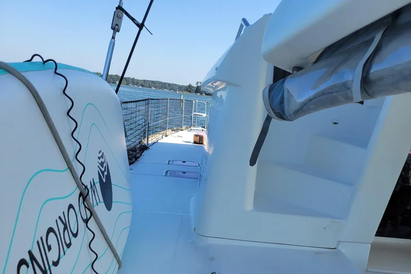 Bear, De Yacht Photos Pics 2011 Lagoon 450 catamaran deck with ocean view and safety netting.