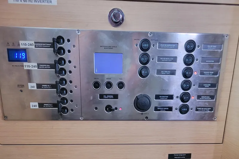 Bear, De Yacht Photos Pics Control panel of a 2011 Lagoon 450 yacht, featuring switches and digital display.