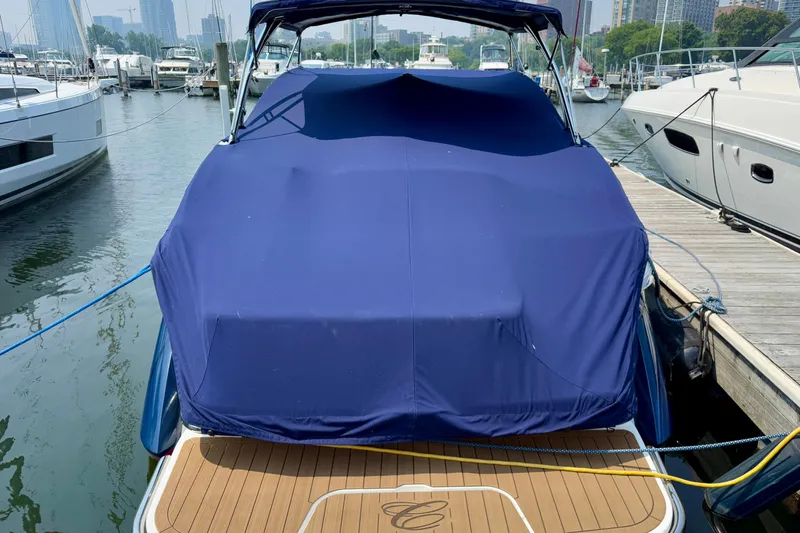  Yacht Photos Pics Covered 2012 Cobalt 323 boat docked at marina with blue tarp.