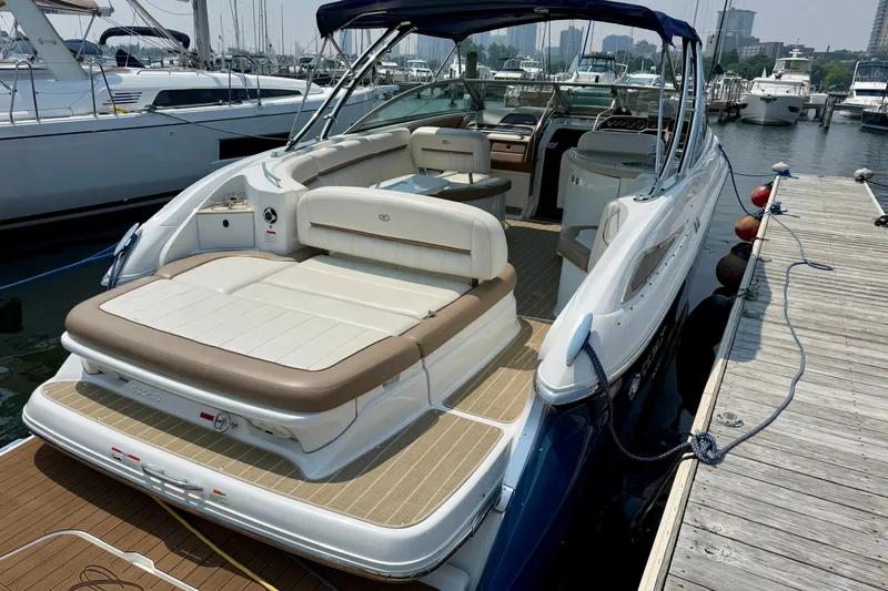  Yacht Photos Pics 2012 Cobalt 323 boat docked at marina, featuring spacious seating and sleek design.
