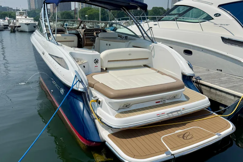  Yacht Photos Pics 2012 Cobalt 323 boat docked, featuring spacious seating and elegant design.