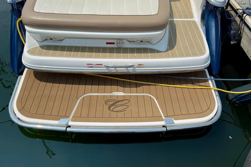  Yacht Photos Pics 2012 Cobalt 323 boat with teak swim platform and cushioned seating.