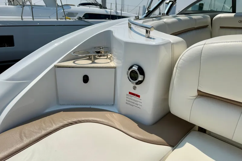  Yacht Photos Pics Luxurious interior of a 2012 Cobalt 323 boat with plush seating and cup holders.