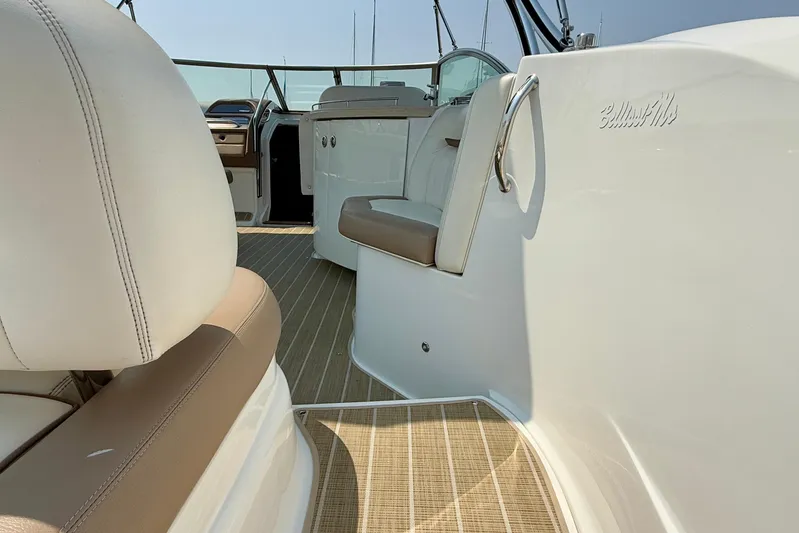  Yacht Photos Pics Interior of a 2012 Cobalt 323 boat with beige and white seating.