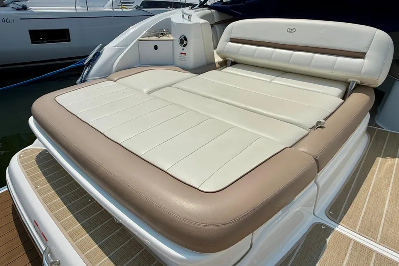  Yacht Photos Pics Luxury sunpad on 2012 Cobalt 323 boat, featuring beige and cream upholstery.