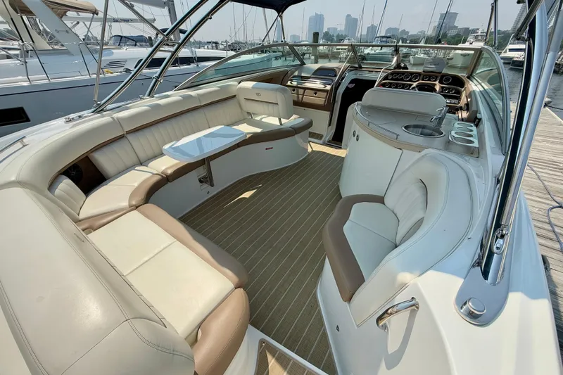  Yacht Photos Pics Luxurious 2012 Cobalt 323 boat interior with plush seating and modern amenities at a marina.