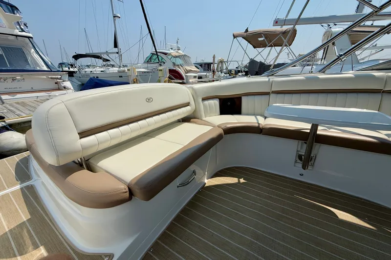  Yacht Photos Pics Luxurious seating on a 2012 Cobalt 323 boat, docked at a marina.