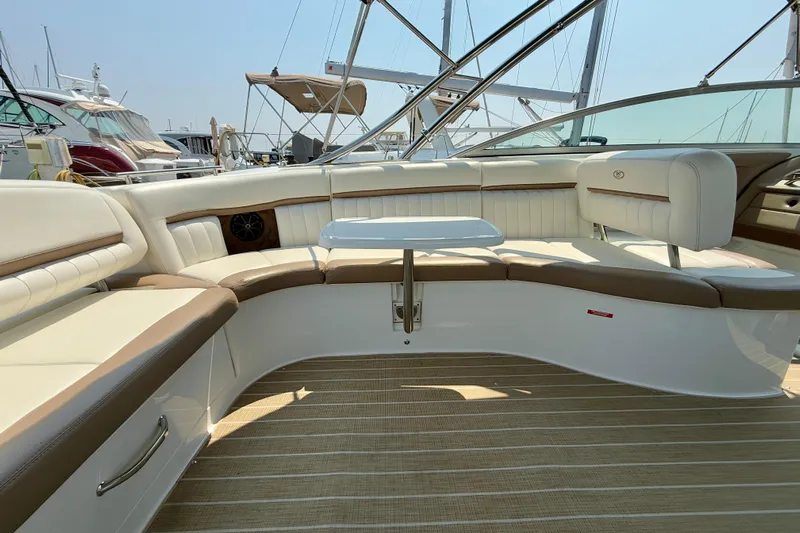  Yacht Photos Pics Luxurious interior of a 2012 Cobalt 323 boat with elegant seating and table.