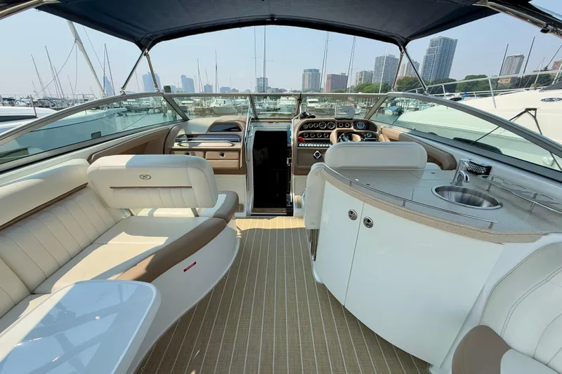  Yacht Photos Pics Luxurious interior of a 2012 Cobalt 323 boat with seating and helm.