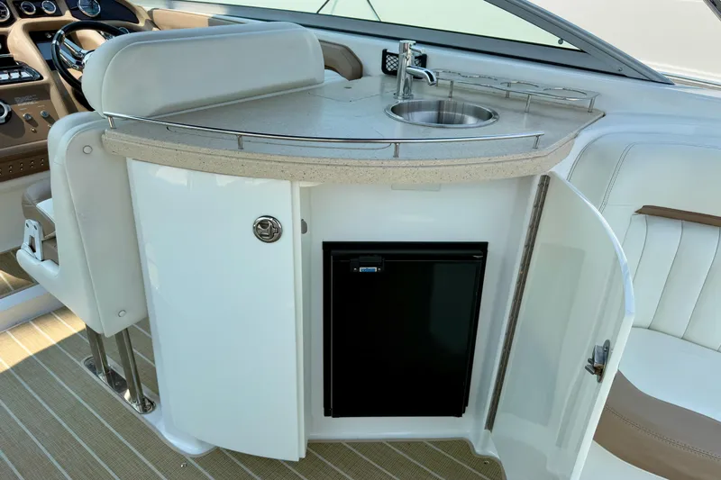 Yacht Photos Pics Luxury boat interior with sink and mini fridge, Cobalt 323, 2012 model.