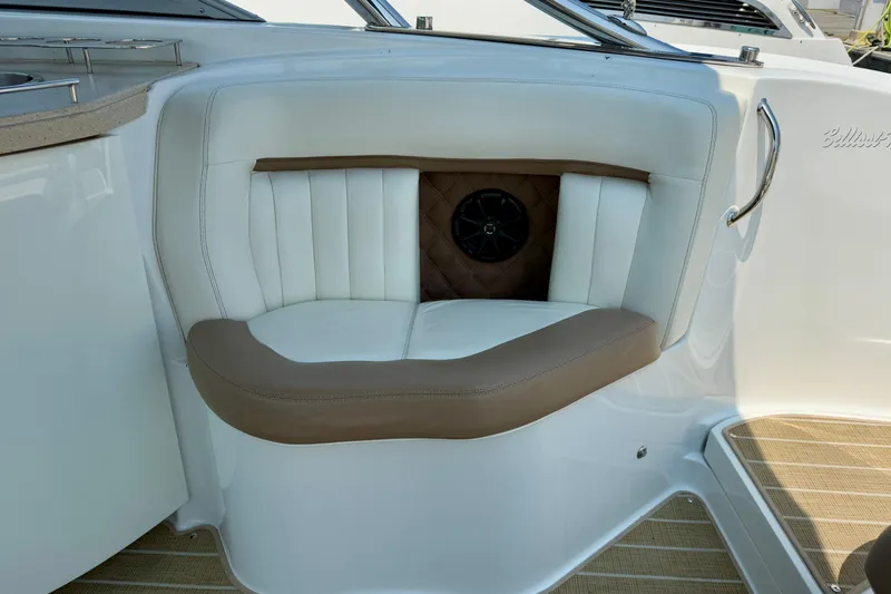  Yacht Photos Pics Luxurious seating on 2012 Cobalt 323 boat with white and brown upholstery.