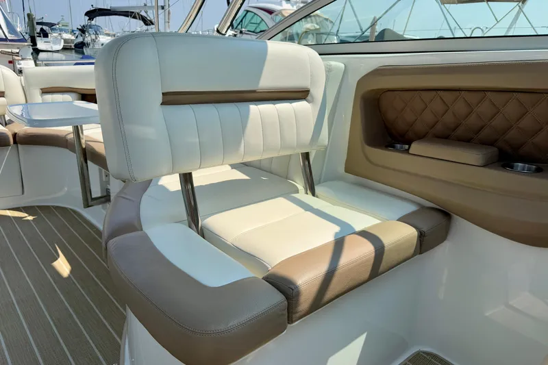  Yacht Photos Pics Luxurious seating on a 2012 Cobalt 323 boat, featuring elegant white and brown upholstery.