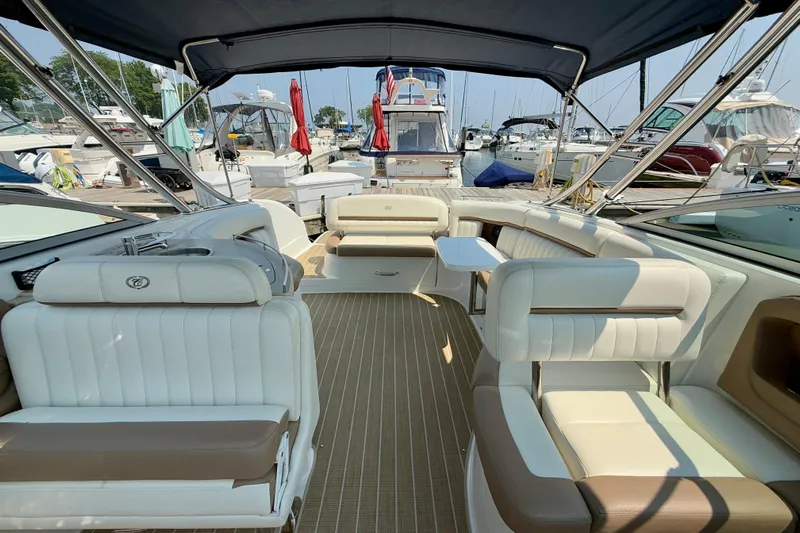  Yacht Photos Pics Luxurious 2012 Cobalt 323 boat interior with plush seating and elegant design at a marina.