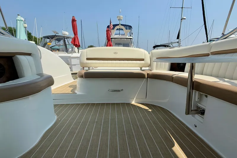  Yacht Photos Pics Luxurious interior of a 2012 Cobalt 323 boat with comfortable seating and elegant design.