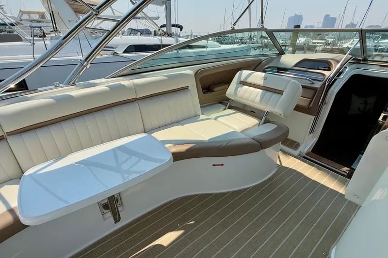  Yacht Photos Pics Luxurious interior of 2012 Cobalt 323 boat with plush seating and table.