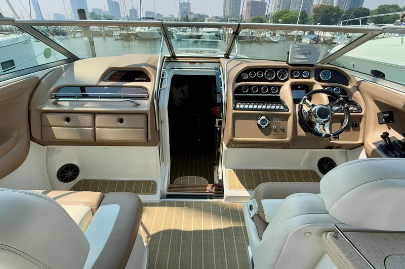  Yacht Photos Pics Interior of a 2012 Cobalt 323 boat with modern dashboard and steering wheel.