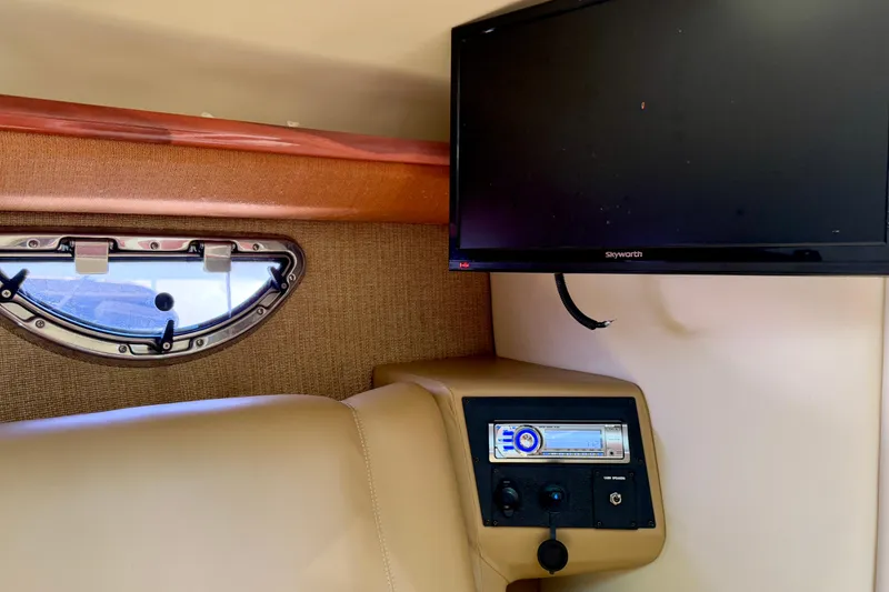  Yacht Photos Pics Interior of 2012 Cobalt 323 boat with TV, window, and audio system.