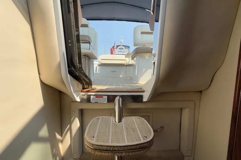  Yacht Photos Pics Interior view of a 2012 Cobalt 323 boat, showcasing seating and deck area.