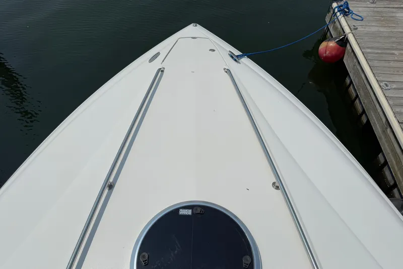  Yacht Photos Pics Bow of a 2012 Cobalt 323 boat docked at a marina.