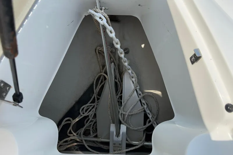  Yacht Photos Pics Anchor storage compartment on a 2012 Cobalt 323 boat with ropes and chains.