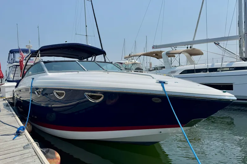  Yacht Photos Pics 2012 Cobalt 323 boat docked at marina, surrounded by other yachts.