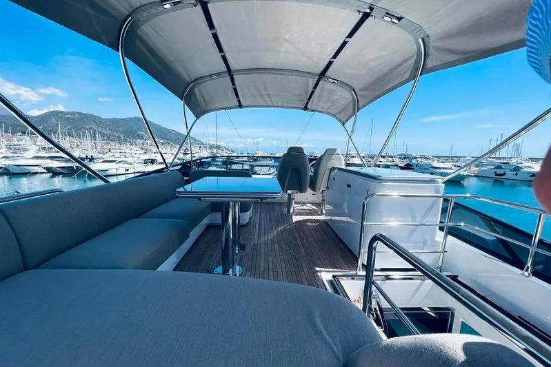  Yacht Photos Pics Luxurious 2023 Azimut S7 yacht interior with elegant seating and marina view.