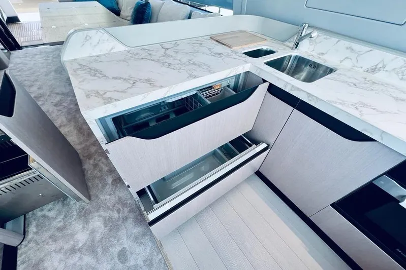  Yacht Photos Pics Luxurious 2023 Azimut S7 yacht kitchen with marble countertops and modern cabinetry.