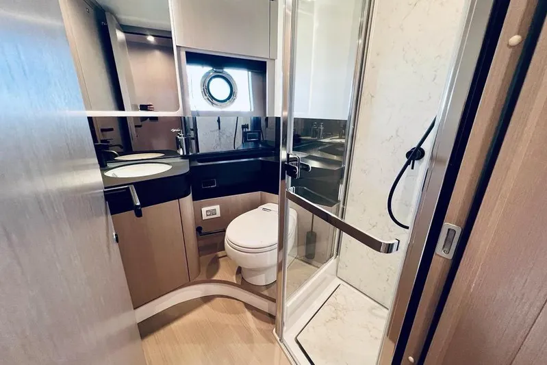 Yacht Photos Pics Luxurious bathroom in 2023 Azimut S7 yacht with modern fixtures and elegant design.