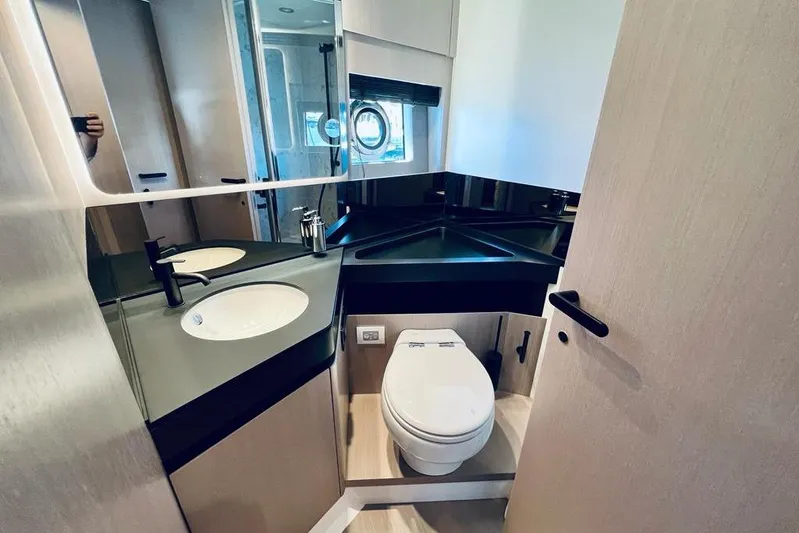  Yacht Photos Pics Luxurious bathroom in 2023 Azimut S7 yacht with modern fixtures and sleek design.