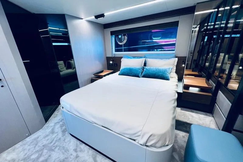  Yacht Photos Pics Luxurious bedroom interior of 2023 Azimut S7 yacht with modern design and plush bedding.