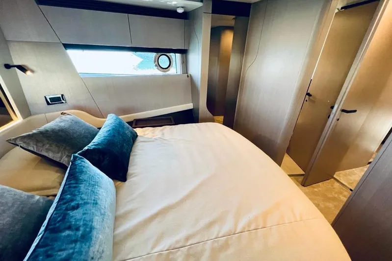  Yacht Photos Pics Luxurious bedroom interior of 2023 Azimut S7 yacht with elegant bedding and modern design.