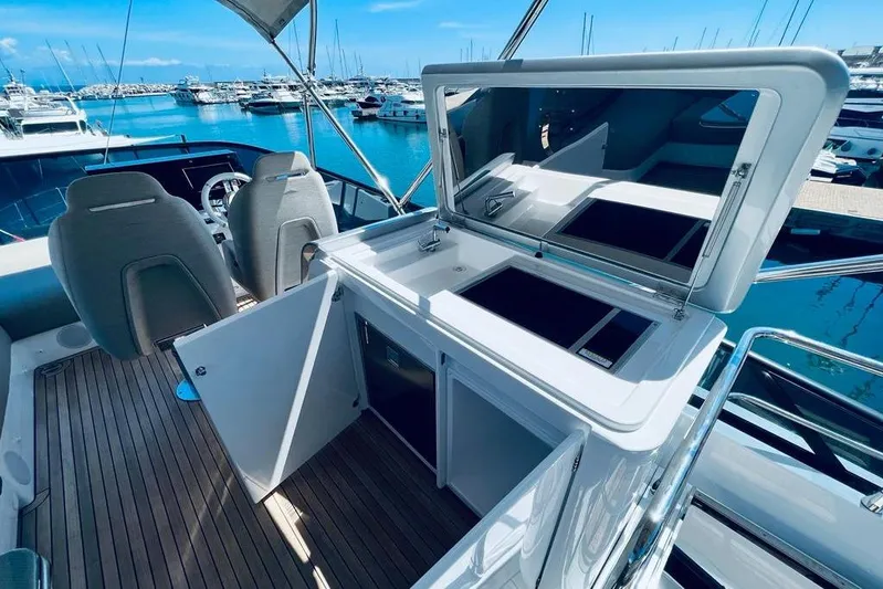  Yacht Photos Pics 2023 Azimut S7 yacht interior with modern helm and sleek design in marina setting.