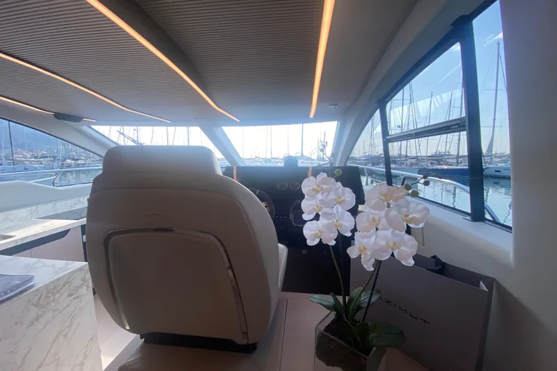 Yacht Photos Pics Interior of 2023 Azimut S7 yacht with elegant seating and white orchids.