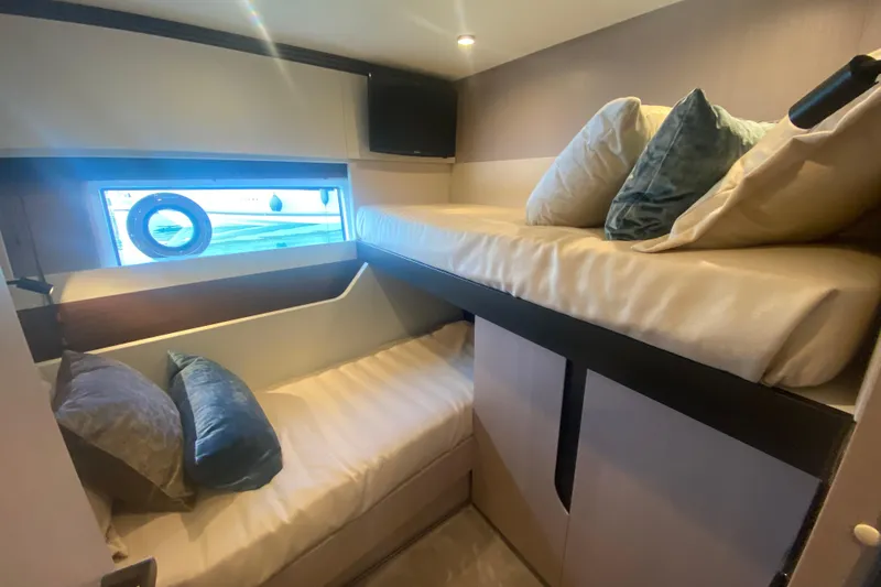  Yacht Photos Pics 2023 Azimut S7 yacht cabin with bunk beds and window view.