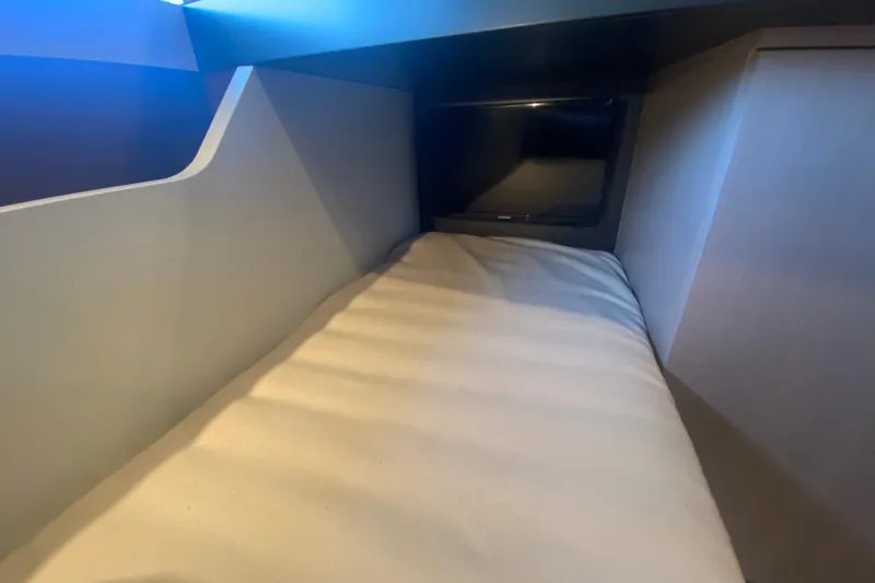  Yacht Photos Pics 2023 Azimut S7 yacht interior cabin with modern design and cozy bedding.