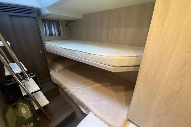  Yacht Photos Pics 2023 Azimut S7 yacht interior with bunk beds and modern wood finish.