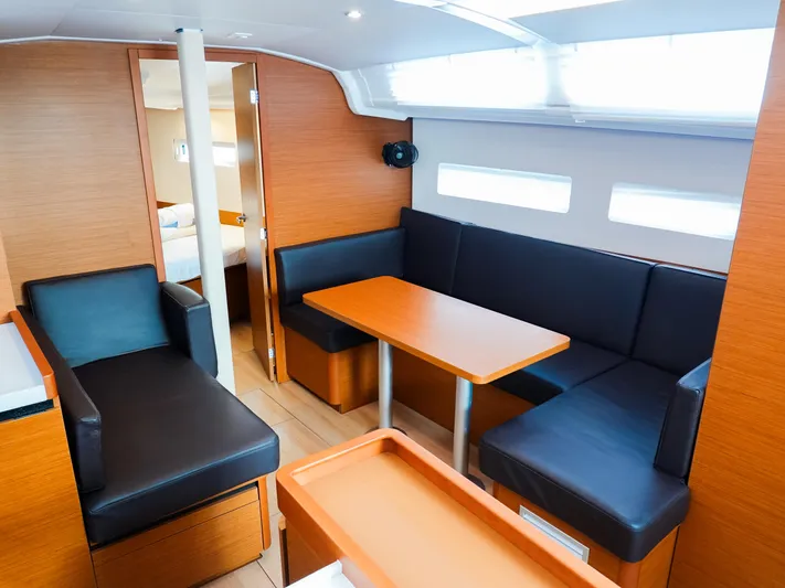 Easy Skanking Yacht Photos Pics 2024 Jeanneau Sun Odyssey 410 interior with modern seating and dining area.