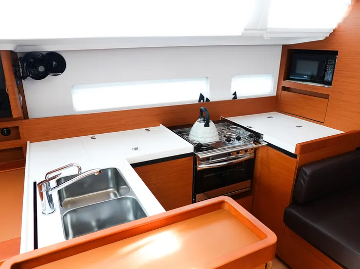Easy Skanking Yacht Photos Pics 2024 Jeanneau Sun Odyssey 410 yacht kitchen with modern appliances and sleek design.