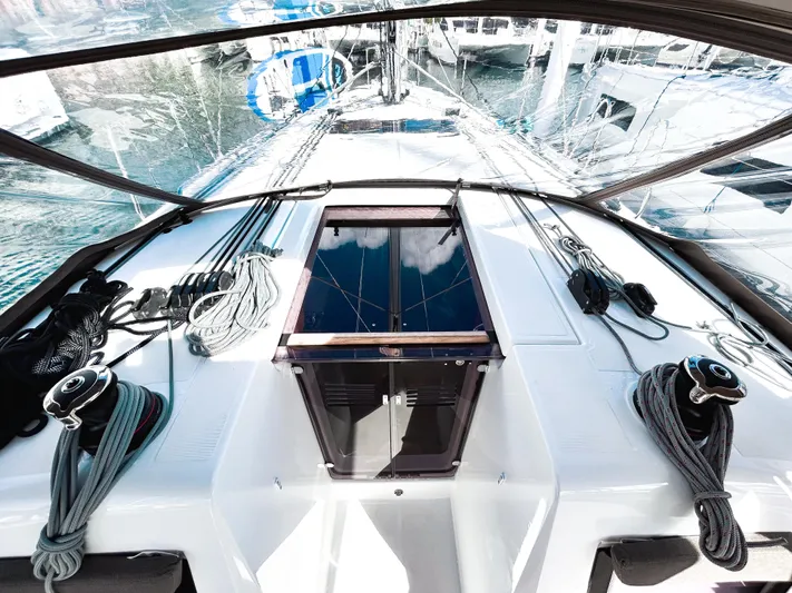 Easy Skanking Yacht Photos Pics 2024 Jeanneau Sun Odyssey 410 yacht deck with ropes and winches, docked at marina.