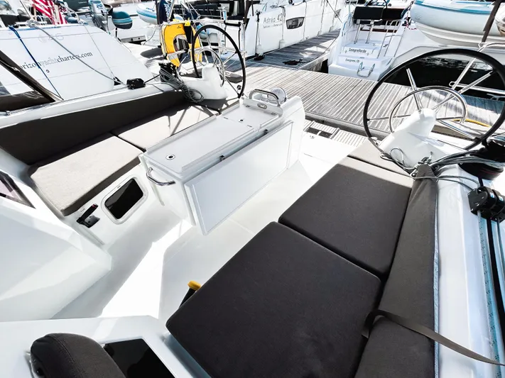 Easy Skanking Yacht Photos Pics 2024 Jeanneau Sun Odyssey 410 cockpit with dual steering wheels and comfortable seating.