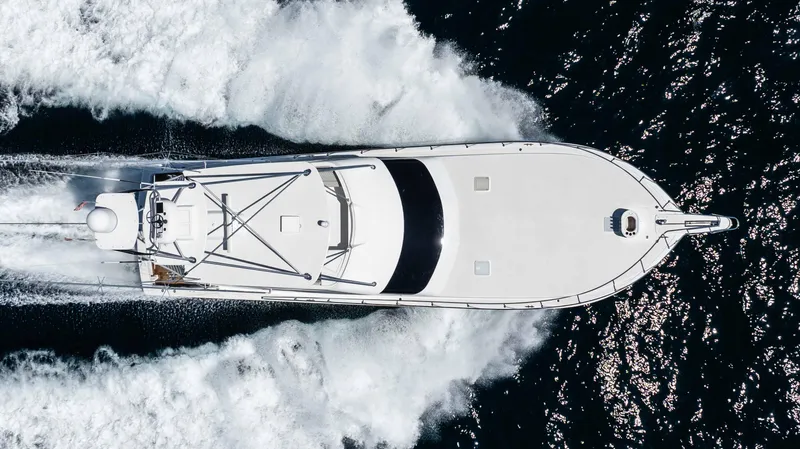 Santana Yacht Photos Pics Aerial view of a 2003 Viking 65 Convertible yacht cruising on the ocean.