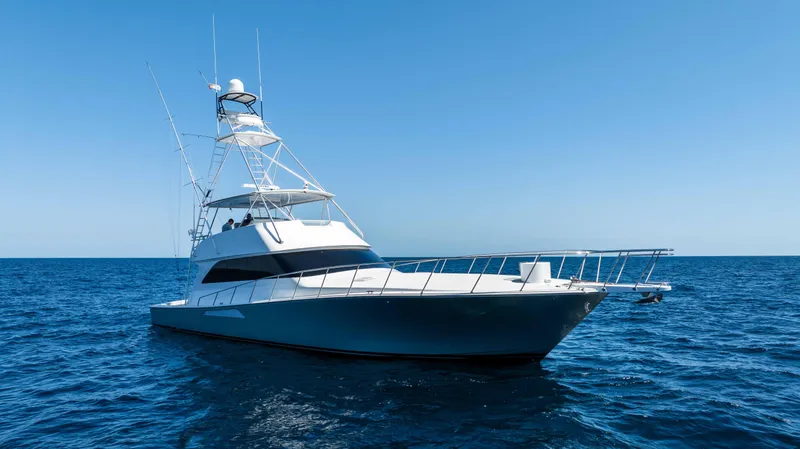 Santana Yacht Photos Pics 2003 Viking 65 Convertible yacht cruising on open sea under clear blue sky.