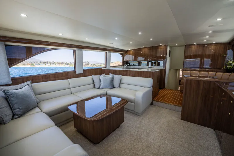 Santana Yacht Photos Pics Luxurious interior of a 2003 Viking 65 Convertible yacht with elegant seating and wood finishes.