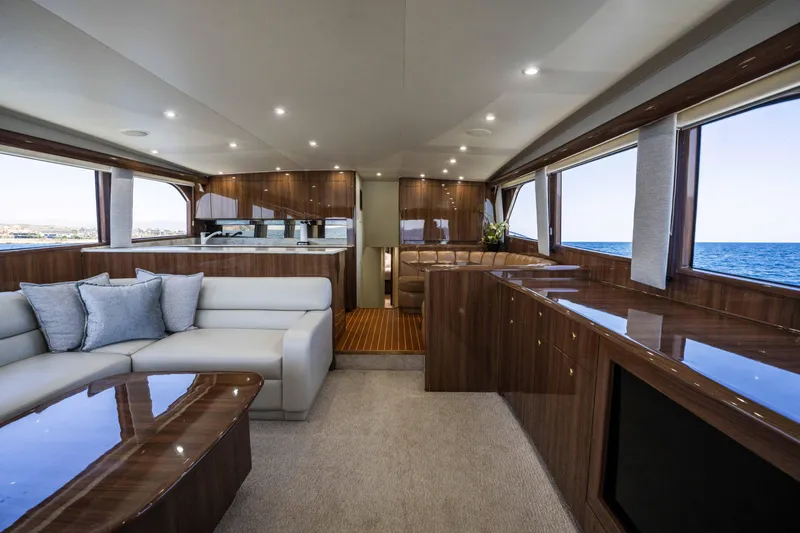 Santana Yacht Photos Pics Luxurious interior of 2003 Viking 65 Convertible yacht with elegant wood finishes and ocean view.